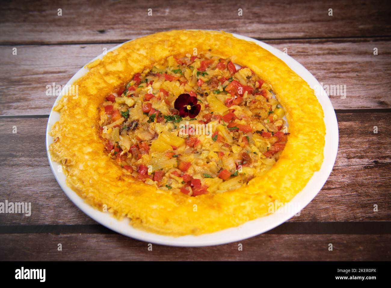 Recipe Omelette with peppers, onions, tomatoes, courgettes and