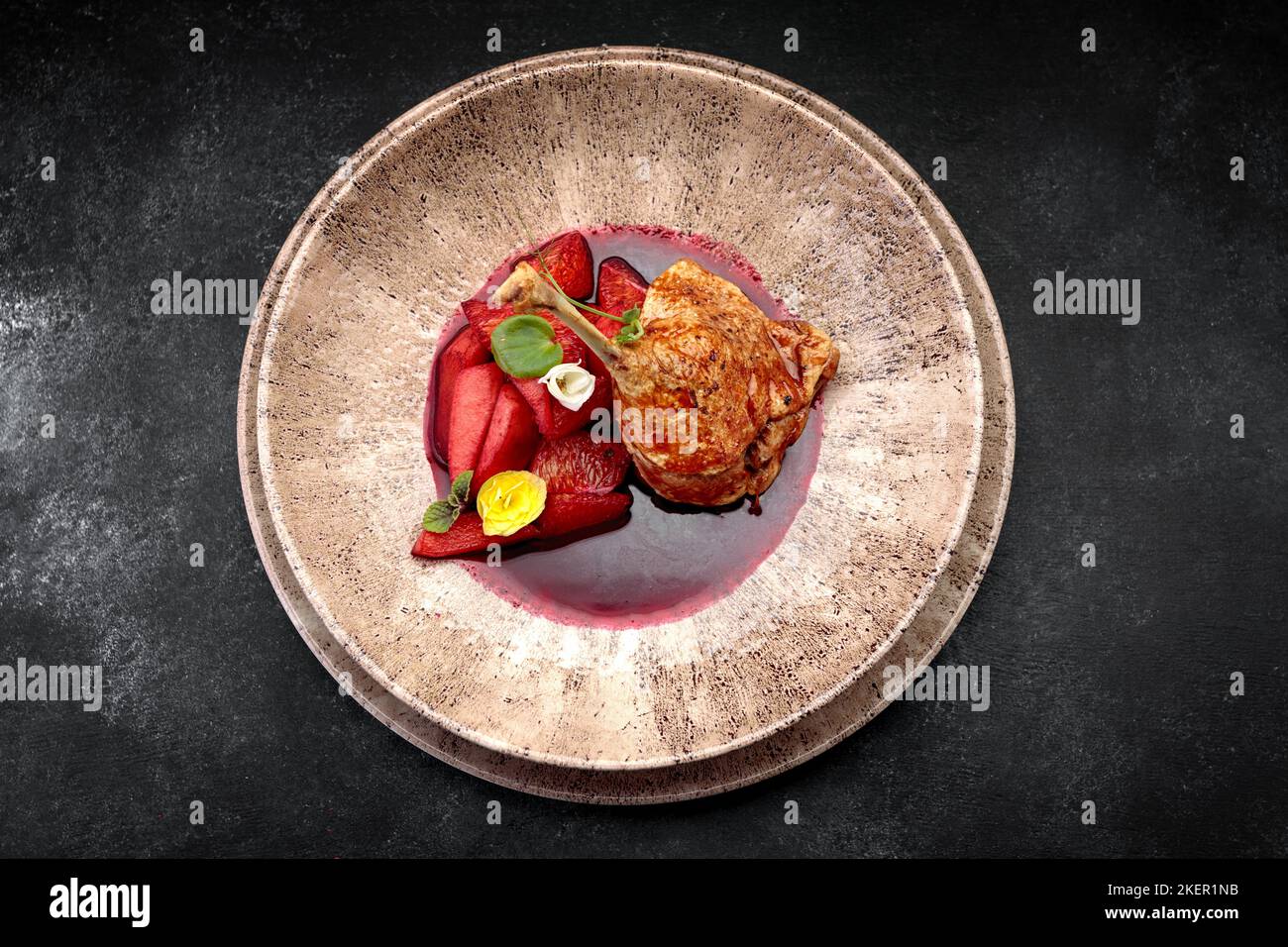 Baked duck leg in sauce with oranges Stock Photo - Alamy