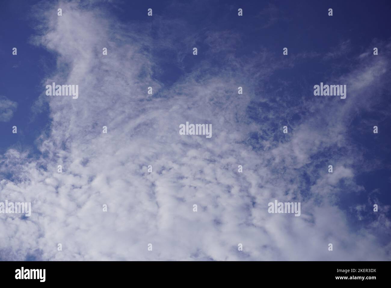 Blue sky with dense white clouds on a sunny day for abstract background and template Stock Photo