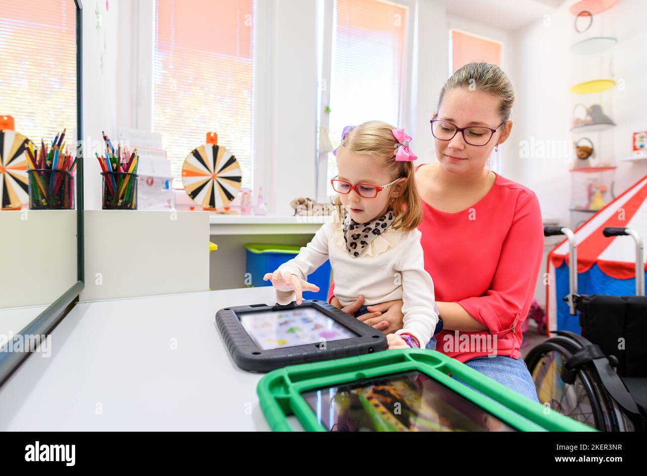 Nonverbal girl living with cerebral palsy, learning to use digital