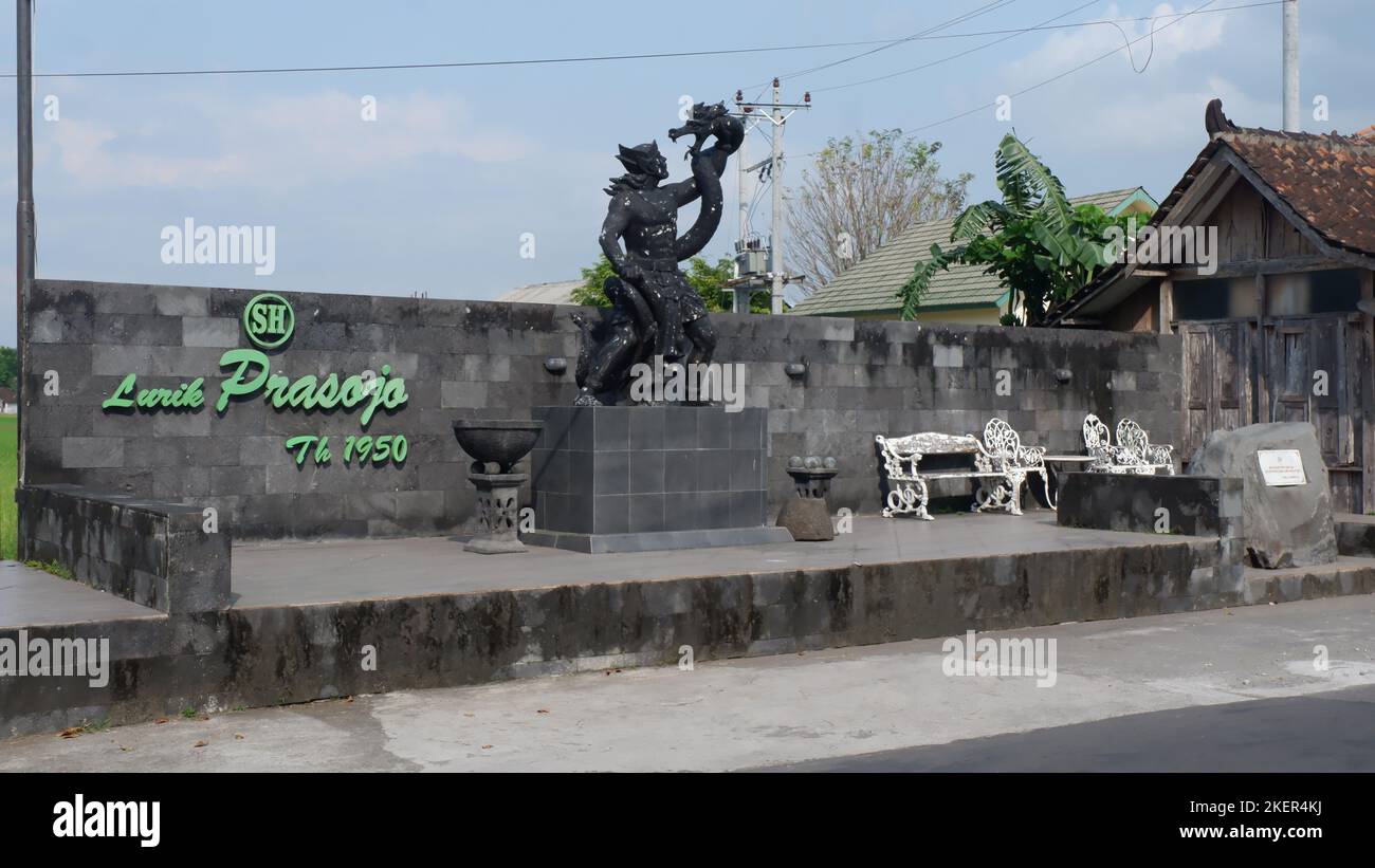 Bima Werkudara statue defeating or holding a dragon snake. Bima is one of the Pandavas in puppet Stock Photo