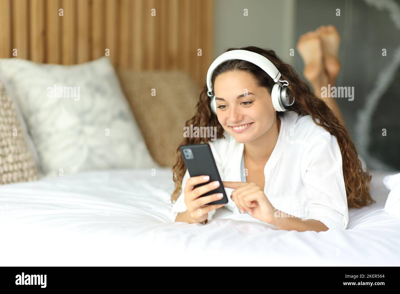 Woman headphones bed hires stock photography and images Alamy