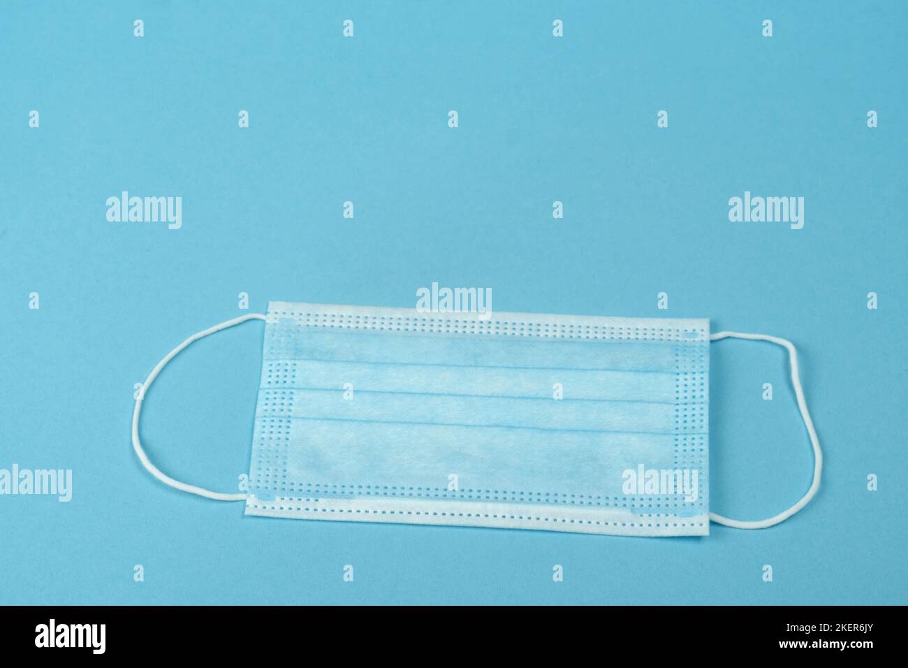 Surgical mask with rubber ear straps. Typical 3ply surgical mask to