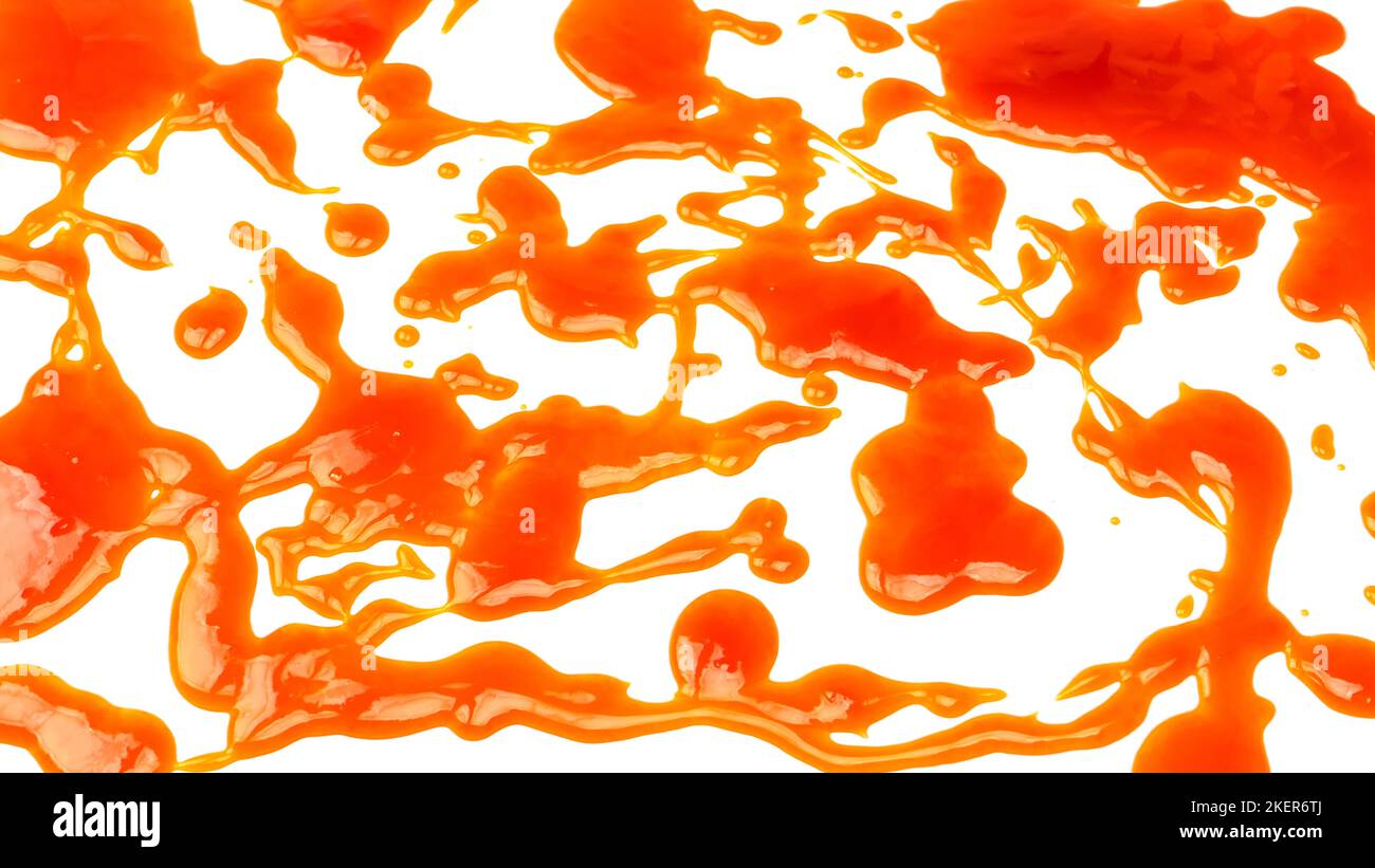 Orange sauce splashes isolated on white a background. Top view. Stock Photo