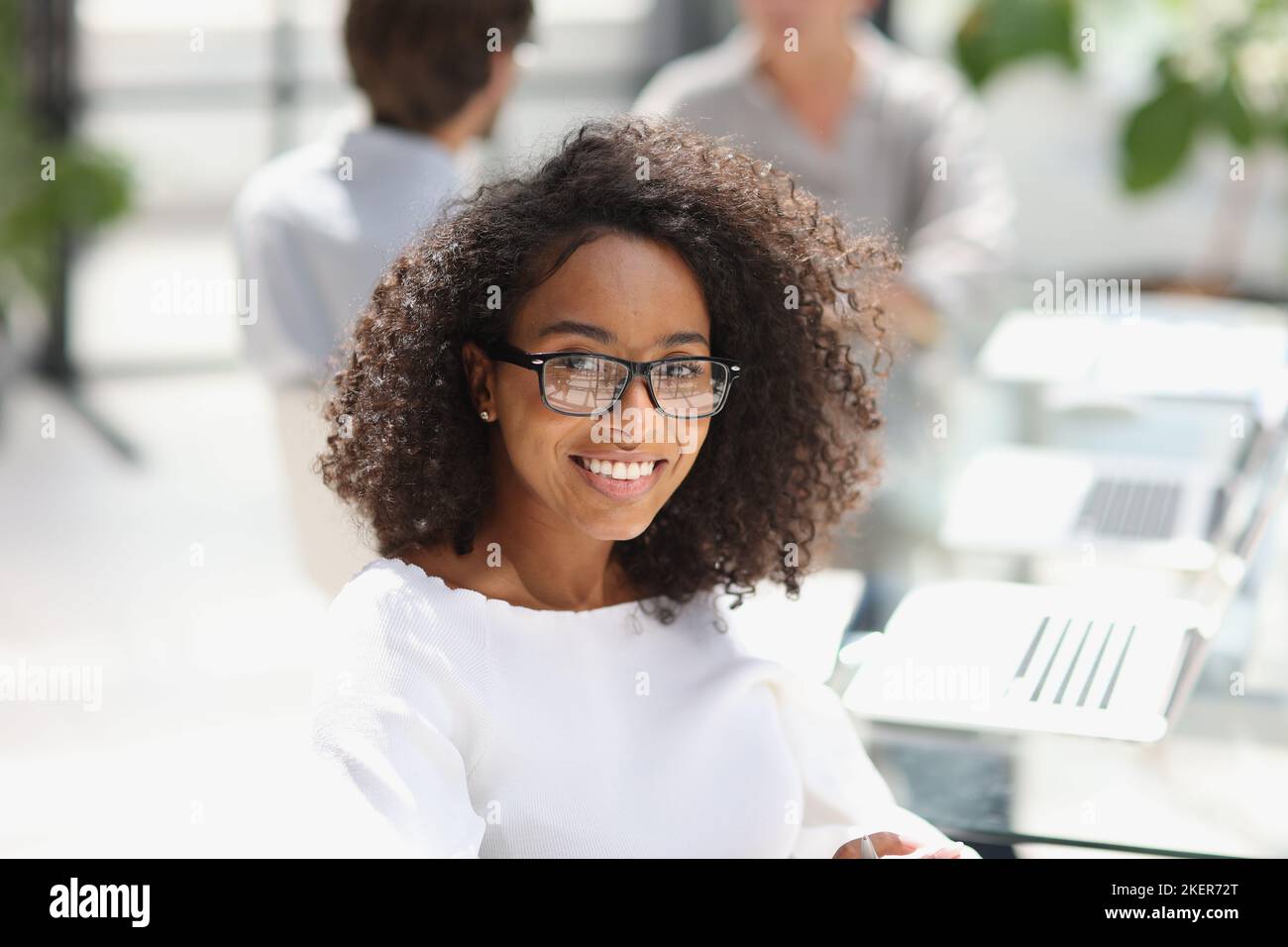 young attractive african american woman in the office Stock Photo - Alamy