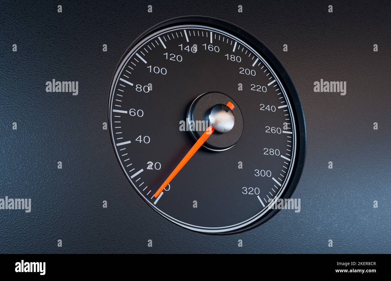 A regular car speedometer with an orange needle pointing towards a slow ...