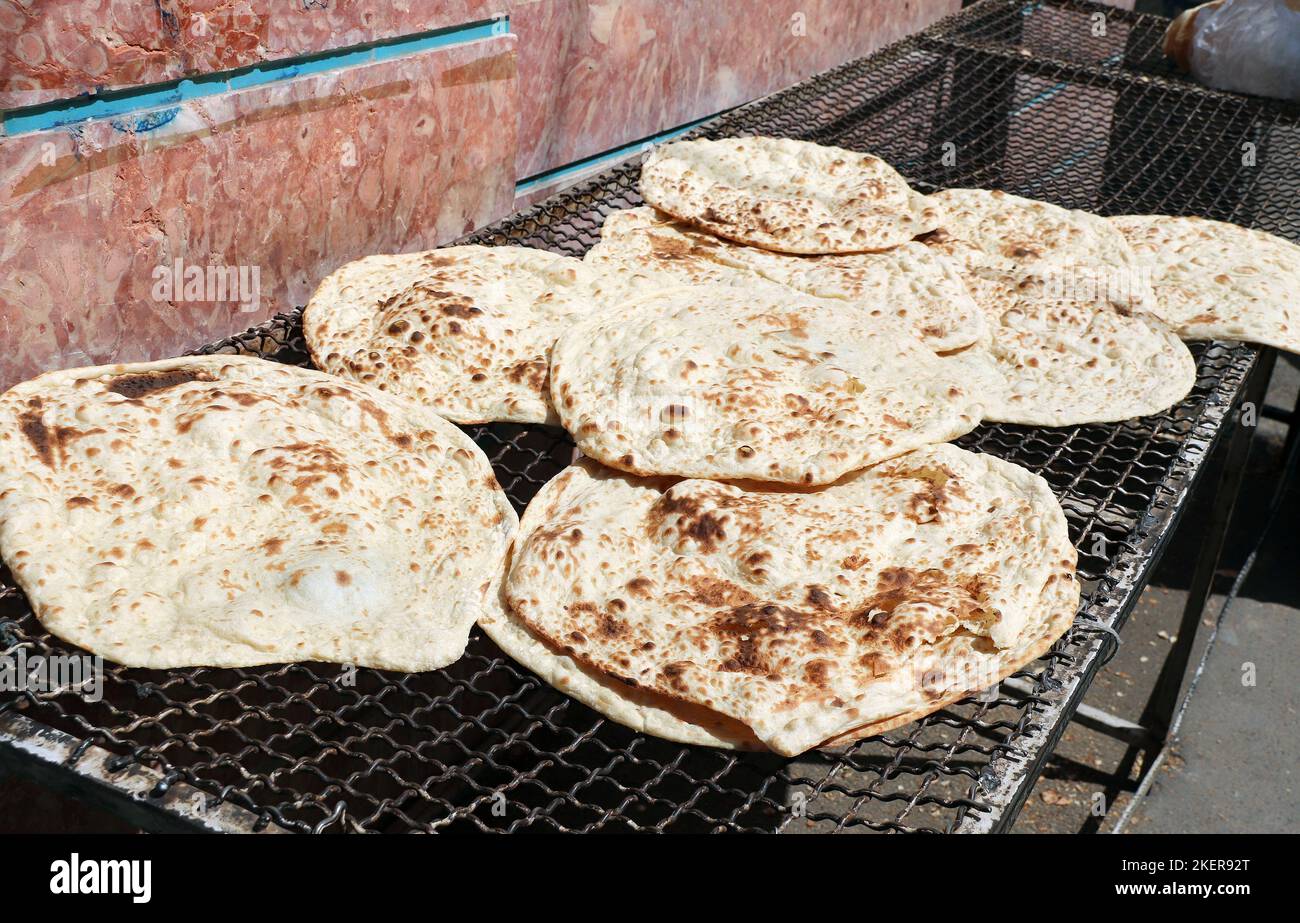 Fresh pitta flatbread. Stack of homemade pita bread for sale at a