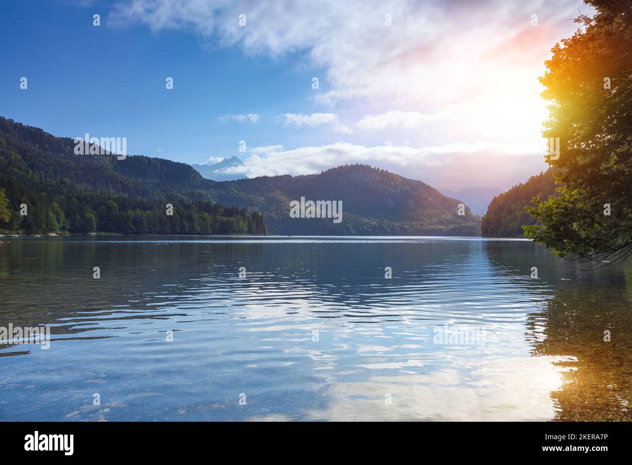 Fantastic sunset of Alpsee lake in the German Alps in Hohenschwangau near castles Hohenschwangau and Neuschwanstein, Allgau, Bavaria, Germany Stock Photo