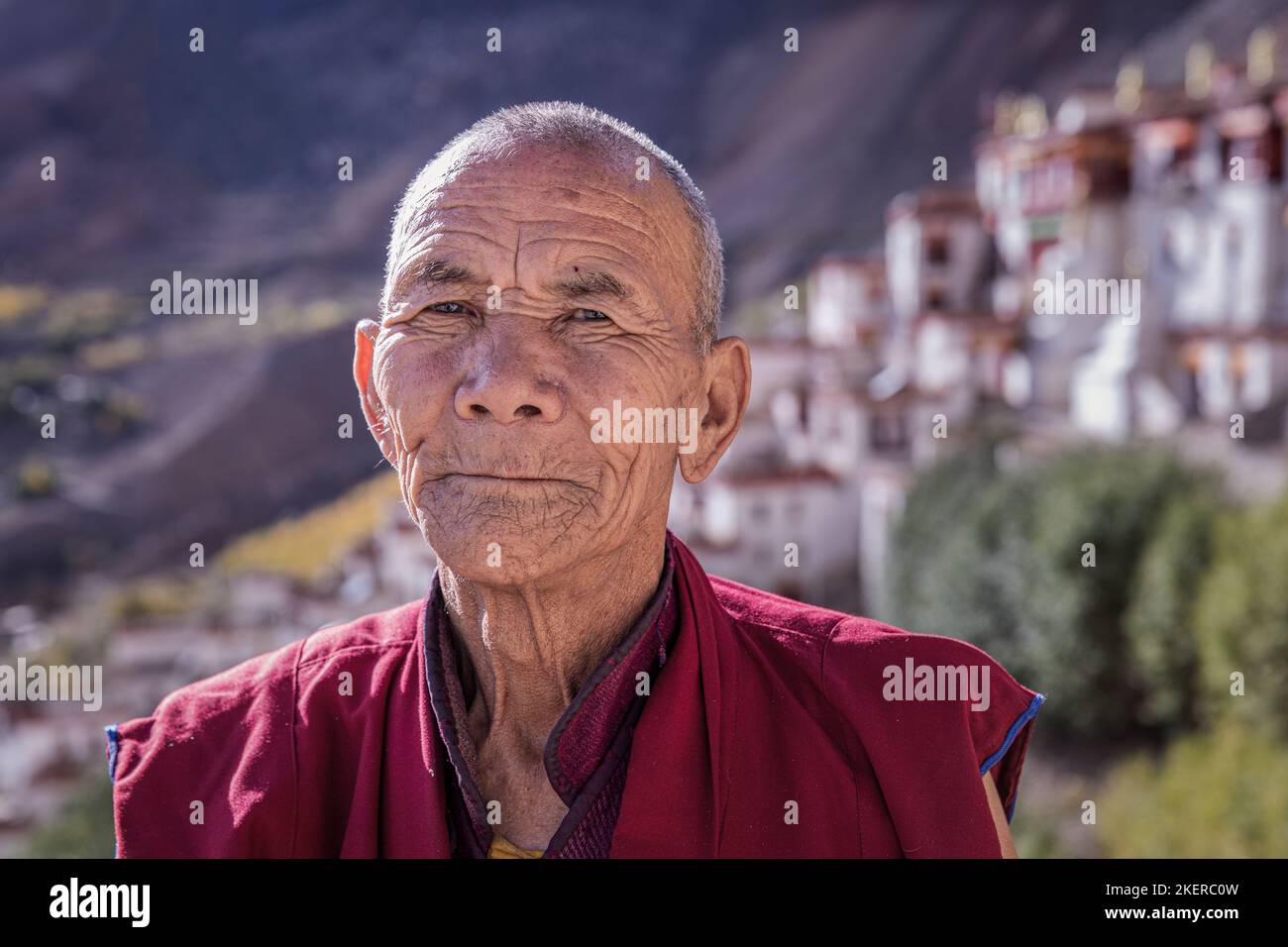 Elderly monk in front of Lingshed, Ladakh, India Stock Photo