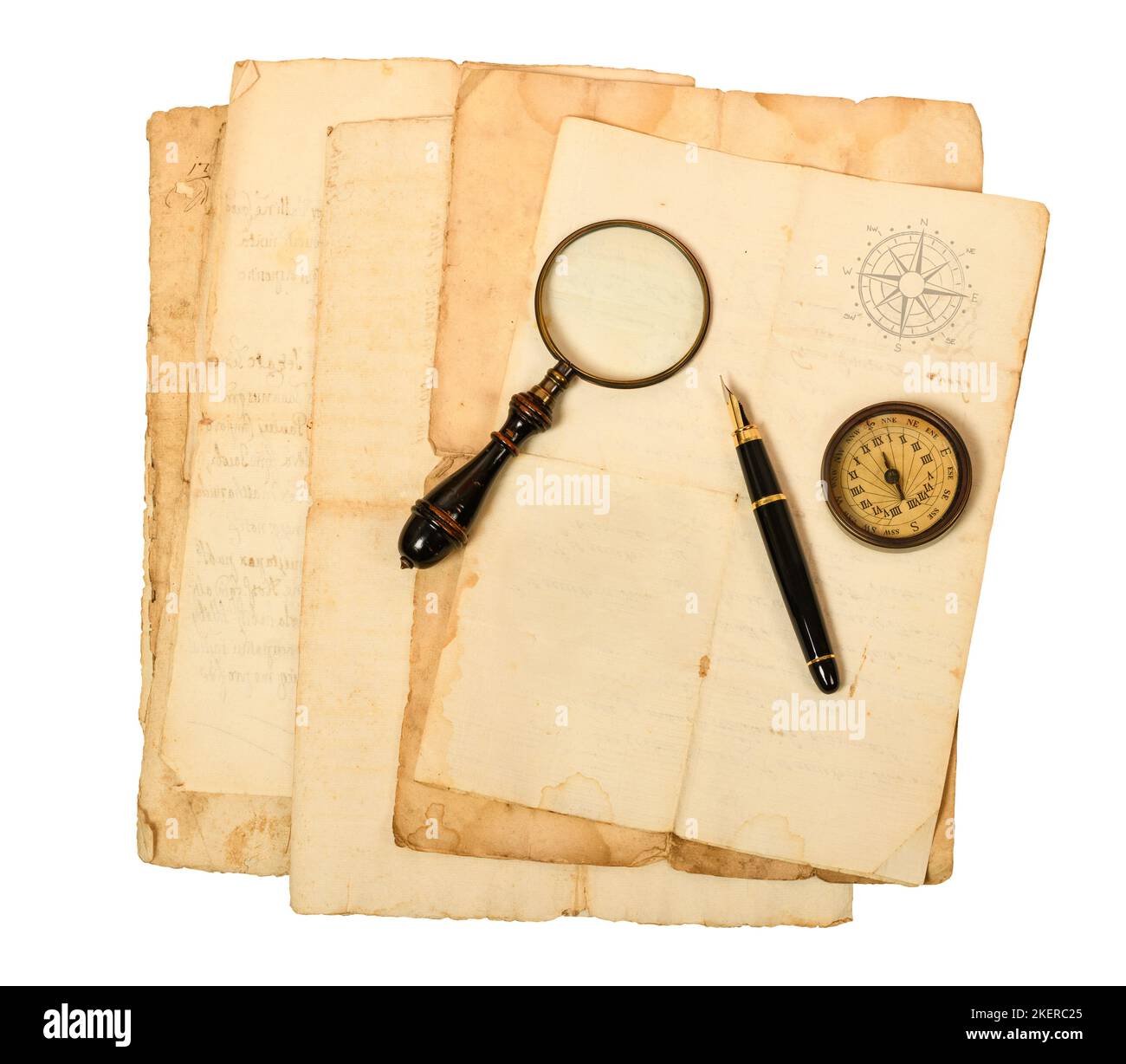 Old  sheets with compass rose magnifying glass and fountain pen isolated on white Stock Photo