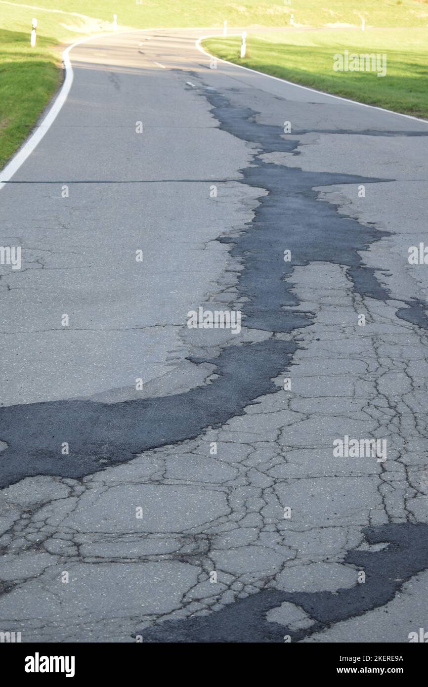 baldy repaired country road with cracks Stock Photo Alamy