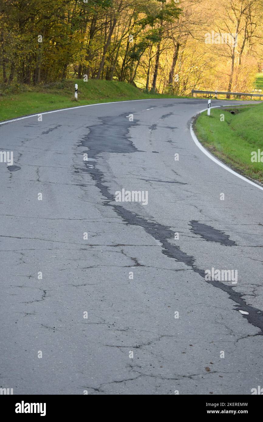 baldy repaired country road with cracks Stock Photo Alamy