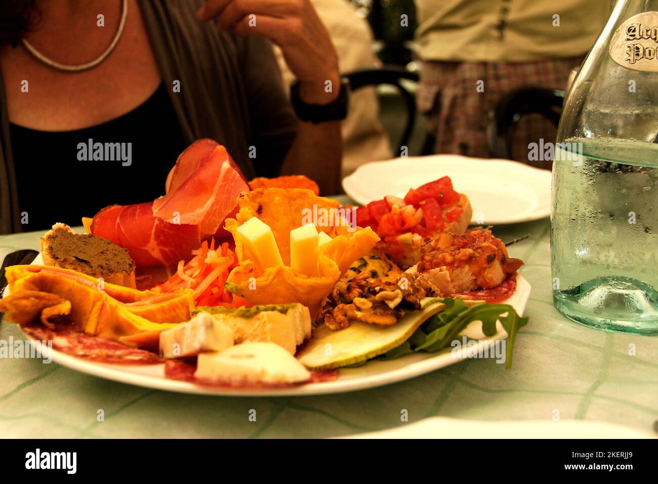 Colourful Plate of food with Tuscanian Antipasti (entres), a gourmet-food in a restaurant, Tuscany, Italy Stock Photo