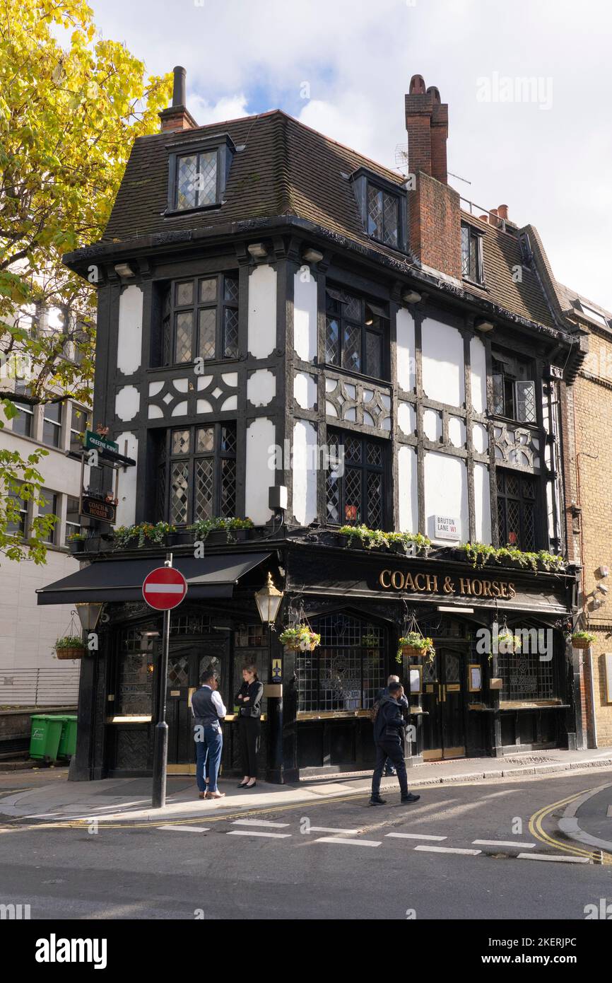 The Coach and Horses on Bruton Lane in Mayfair - a very narrow mock Tudor British pub dating back to the 1770s - owned by Greene King brewery. England Stock Photo