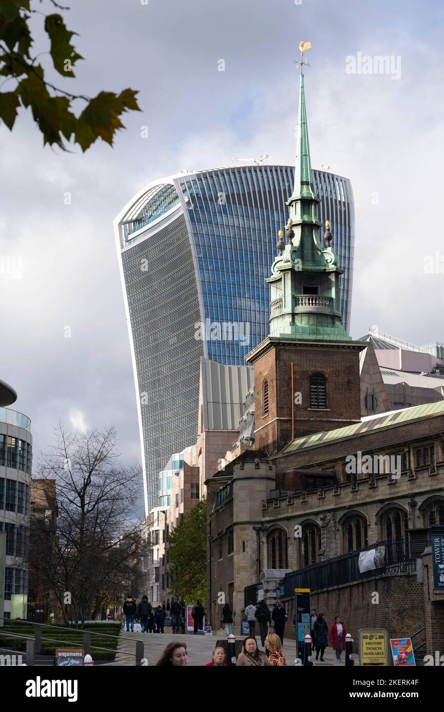 The ancient 7th century All Hallows-by-the-Tower church spire in front of the 21st century Walkie-Talkie (The Fenchurch building). London, England Stock Photo