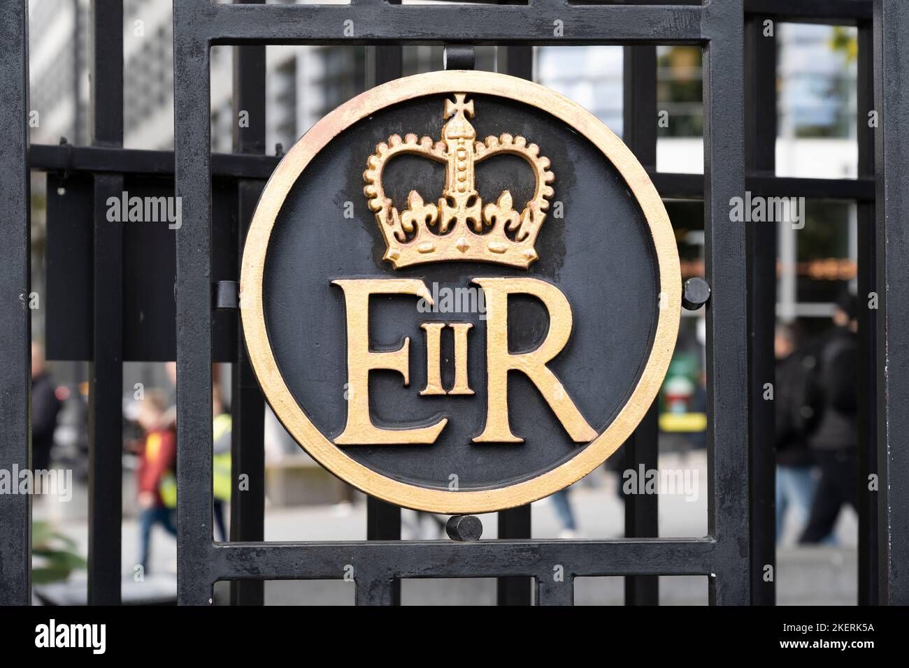 ER in black and gold paint - Elizabeth II Regina (EIIR), the royal cypher of Queen Elizabeth II, on a gate outside the Tower of London, England Stock Photo