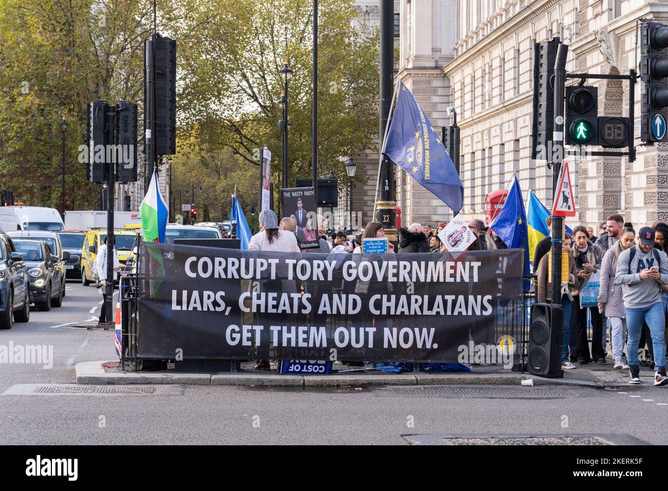A protest group on Parliament St, London, protesting against the Tory Party and Brexit, with a banner saying 'Corrupt Tory Government...' 9th Nov 2022 Stock Photo