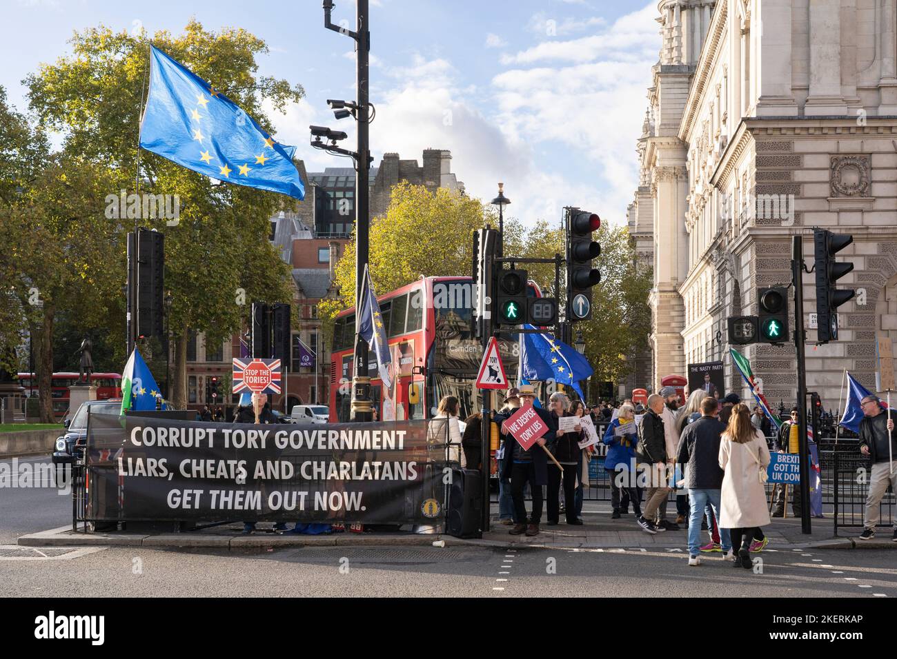A protest group on Parliament St, London, protesting against the Tory Party and Brexit, with a banner saying 'Corrupt Tory Government...' 9th Nov 2022 Stock Photo