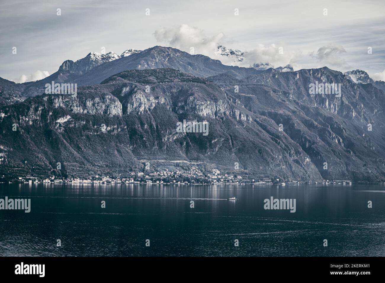 A dramatic view of Bellagio on the coast of Lake Como with the Alps in the background. Stock Photo
