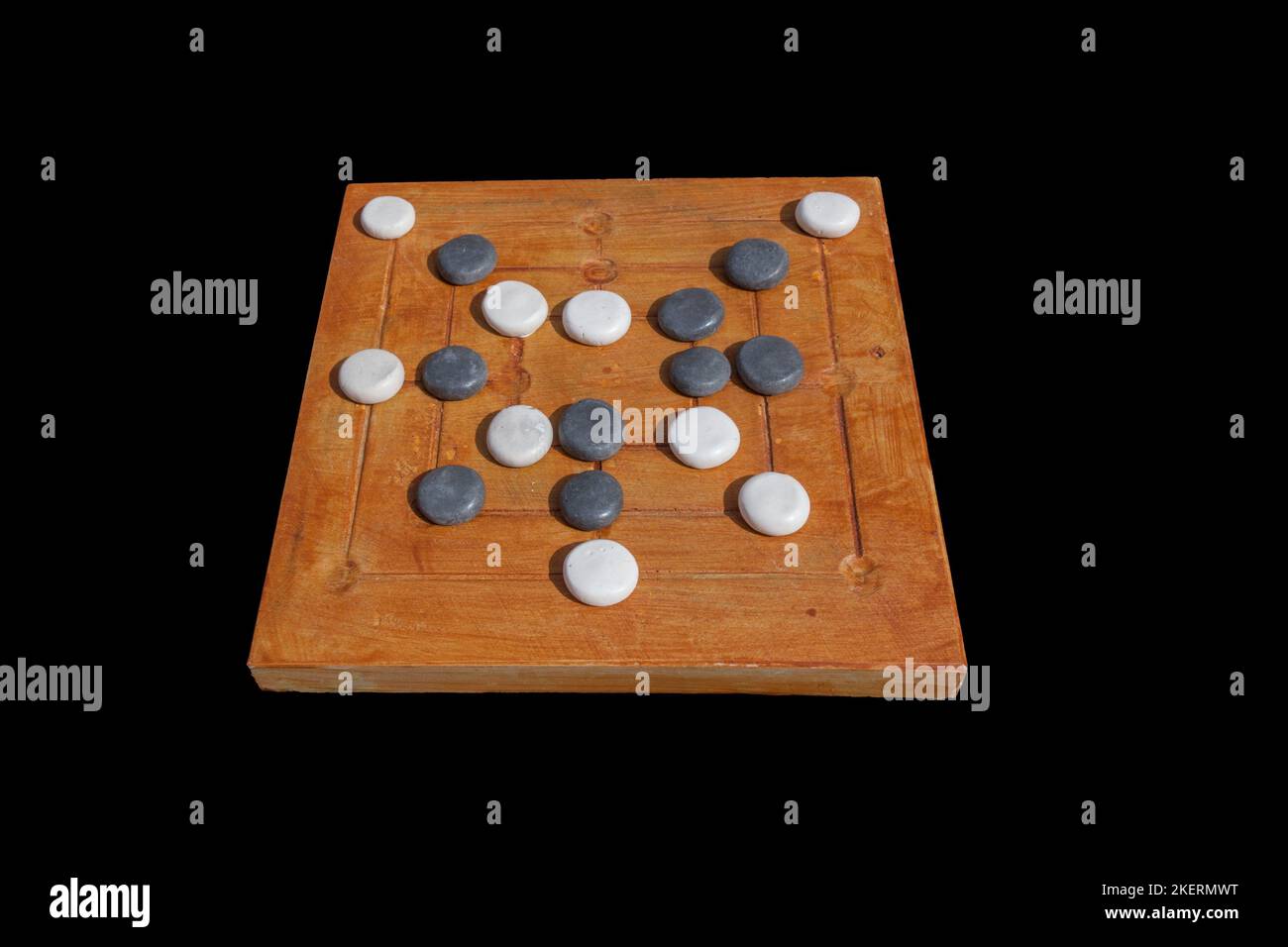 Reconstruction of roman board game Nine mens morris or mill game. Private recreational activity of ancient romans. Stock Photo