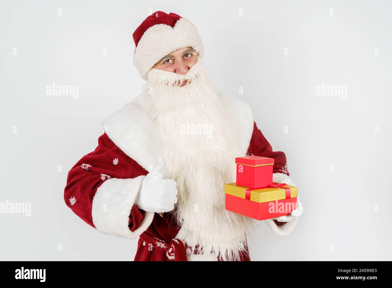 Holidays and Christmas concepts. Santa Claus holds a gift in his hand ...