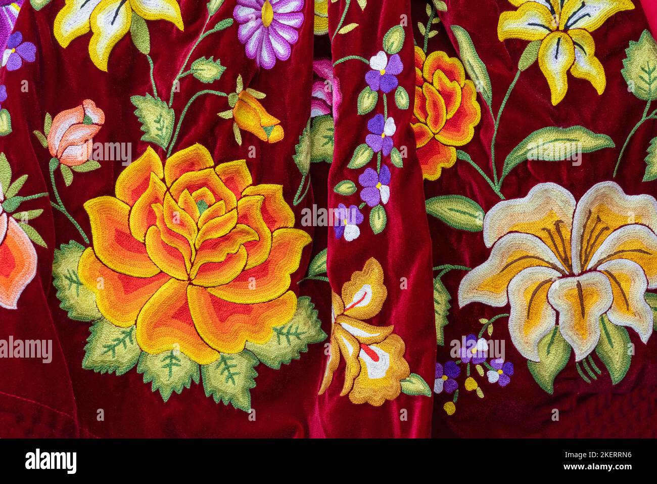 A colorful hand-embroidered blouse with floral pattern on velvet typical of the Istmo Region of the Pacific Coast, Oaxaca, Mexico. Stock Photo