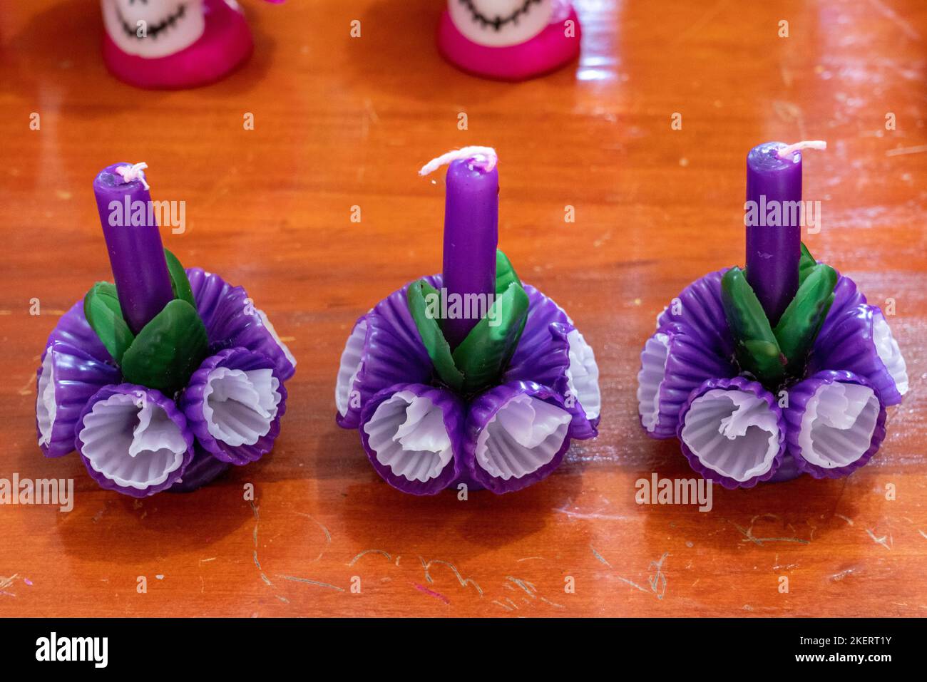 Fancy candles with elaborate wax flowers made by hand in a in