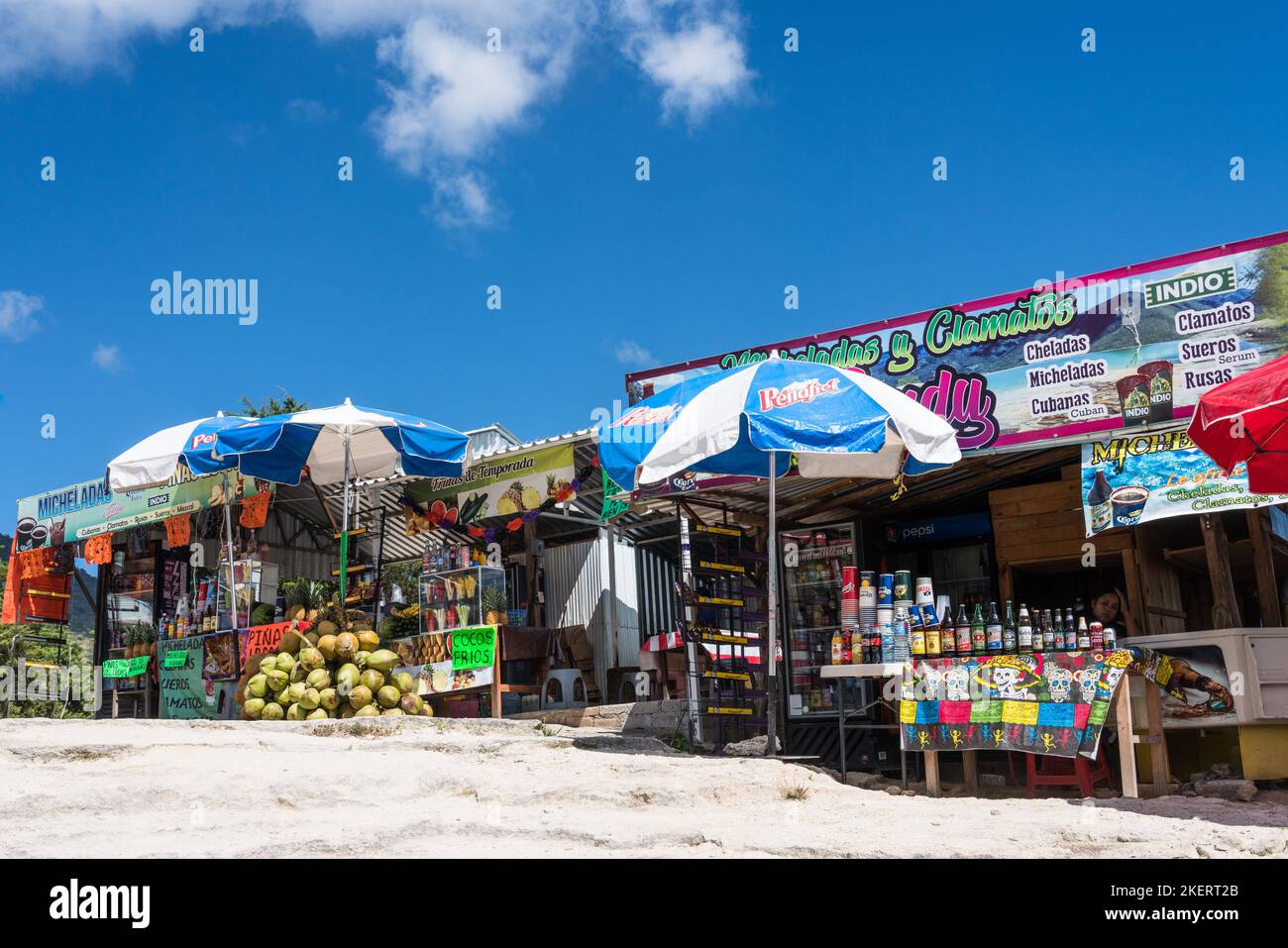 Refreshement stands and green coconuts for coconut milk drinks at