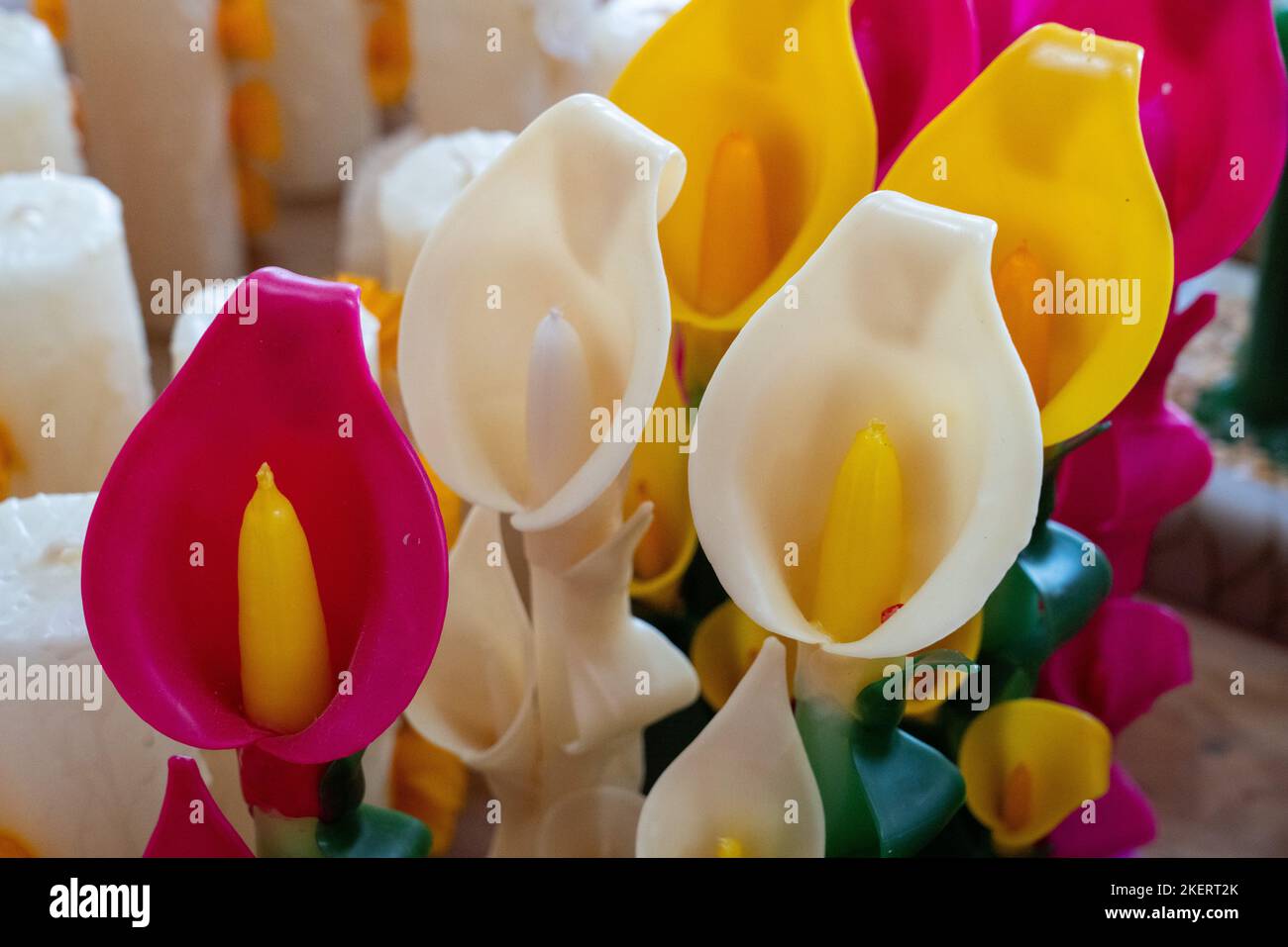 Fancy candles in the shape of calla lilies made by hand in a candle