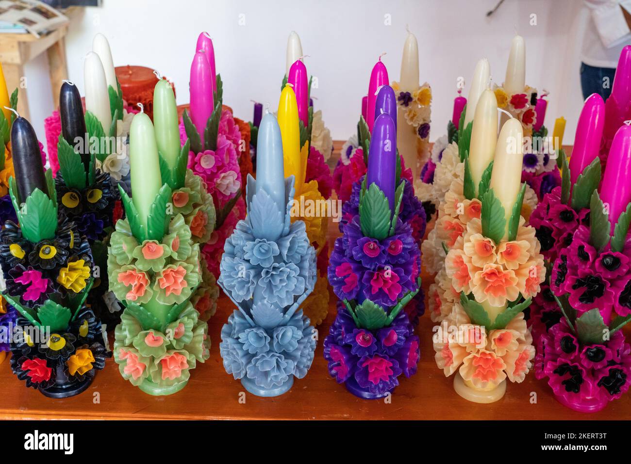 Fancy candles with elaborate wax flowers made by hand in a in