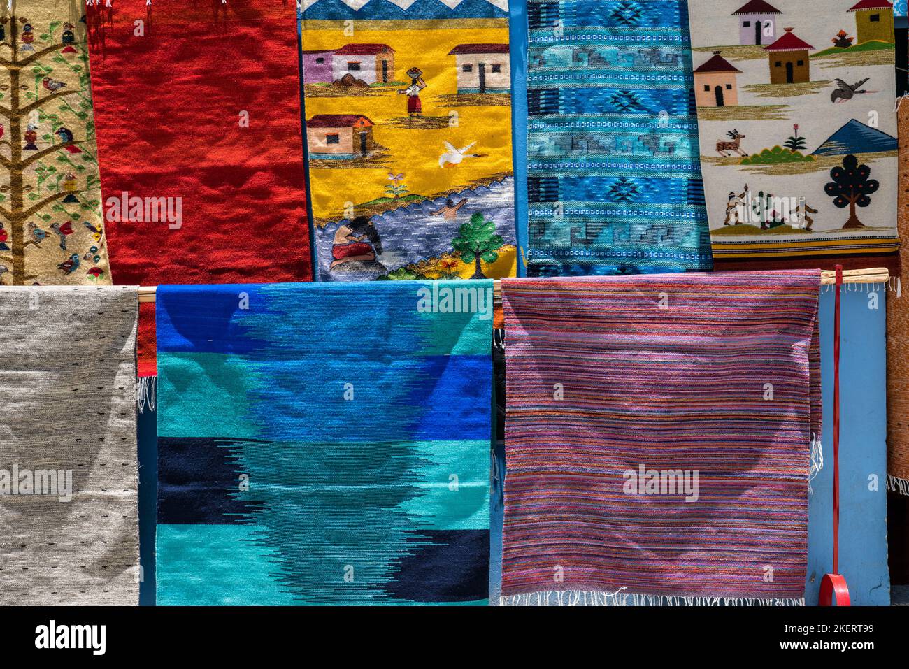 Handwoven wool rugs with Zapotec designs for sale on the street in