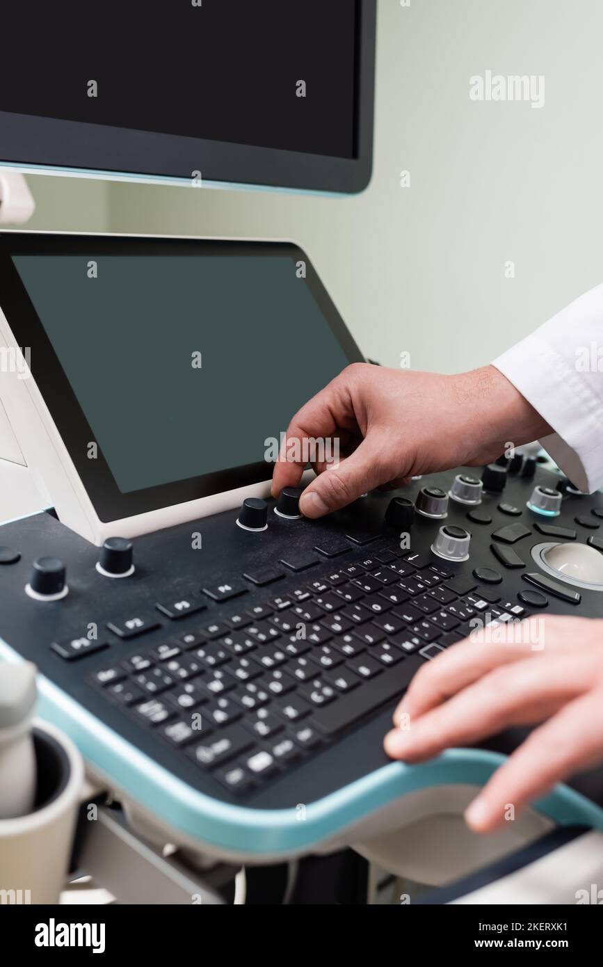Doctor adjusting ultrasound machine hi-res stock photography and images ...