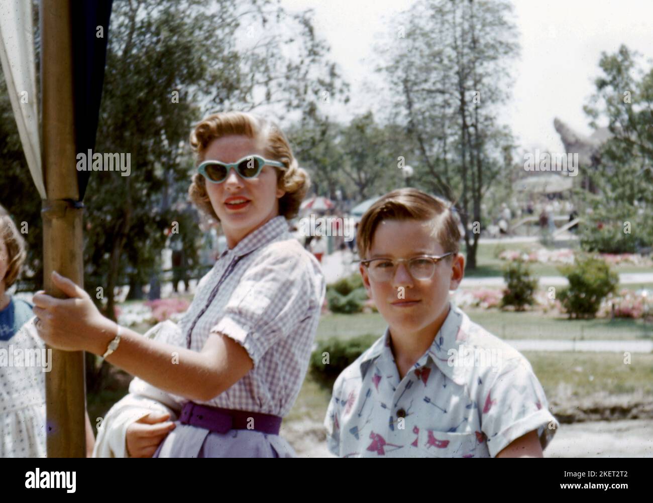 A mother in stylish sunglasses and dress with son on an outing in 1956   Photo by Tony Henshaw Archive Stock Photo