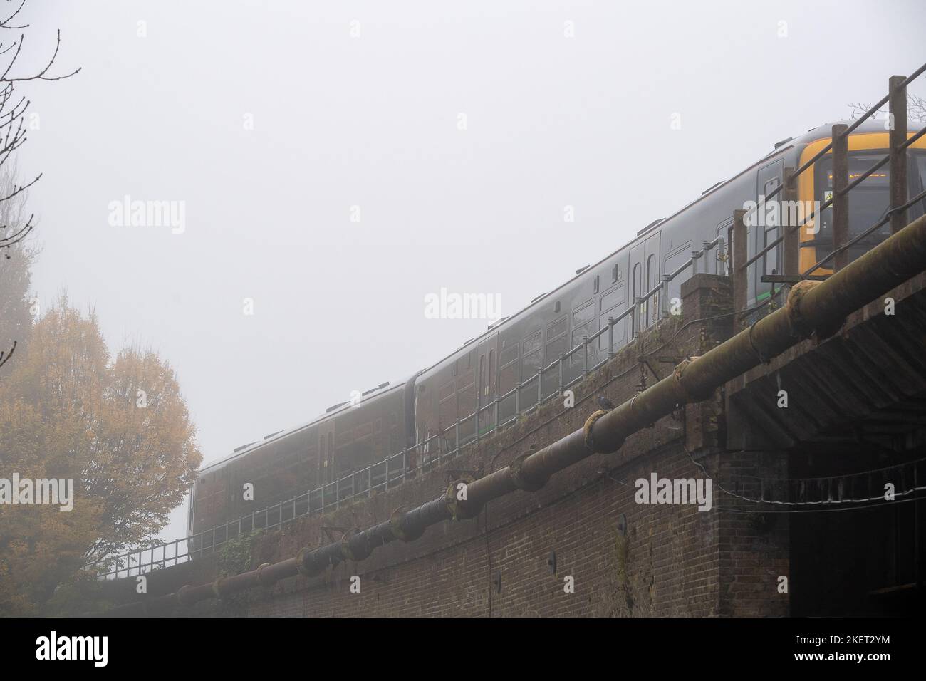 Windsor, Berkshire, UK. 14th November, 2022. A foggy commute on the Great Western Railway train from Windsor to Slough. After a beautiful sunny day yesterday, it was a foggy morning in Windsor, Berkshire. A yellow weather warning for fog was issued by the Met Office until 10am this morning. Credit: Maureen McLean/Alamy Live News Stock Photo