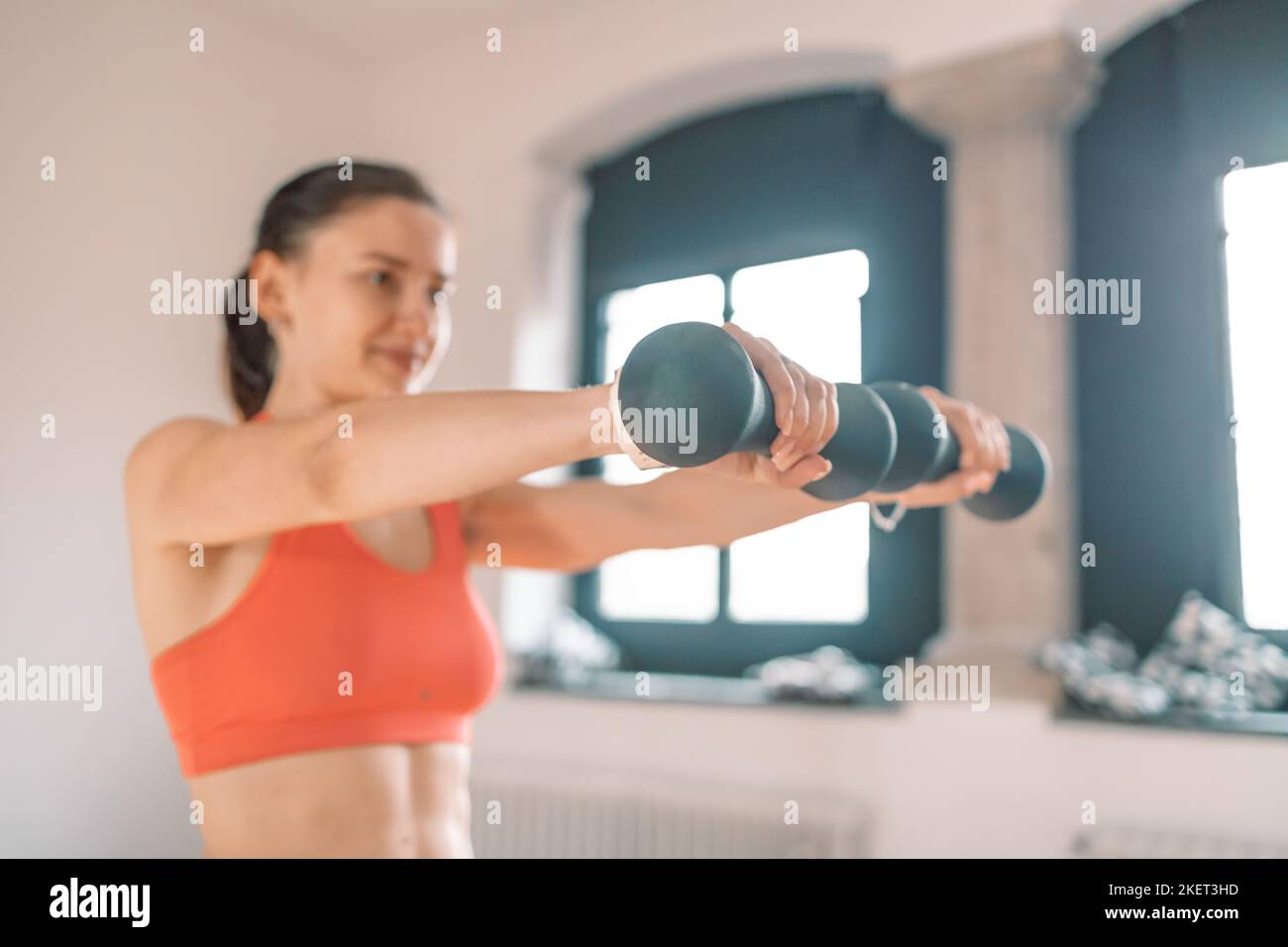 Strength and motivation. Sporty young woman being in good physical