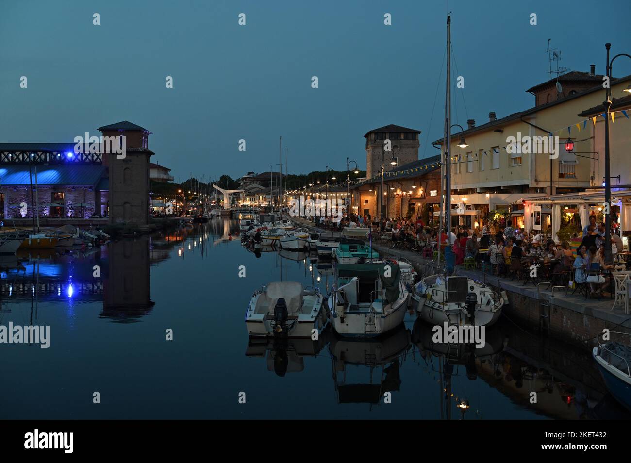 The Canal Harbor Of Cervia At Dusk Restaurants And Bars Animate The The Canal Harbor Of Cervia At Dusk Restaurants And Bars Animate The