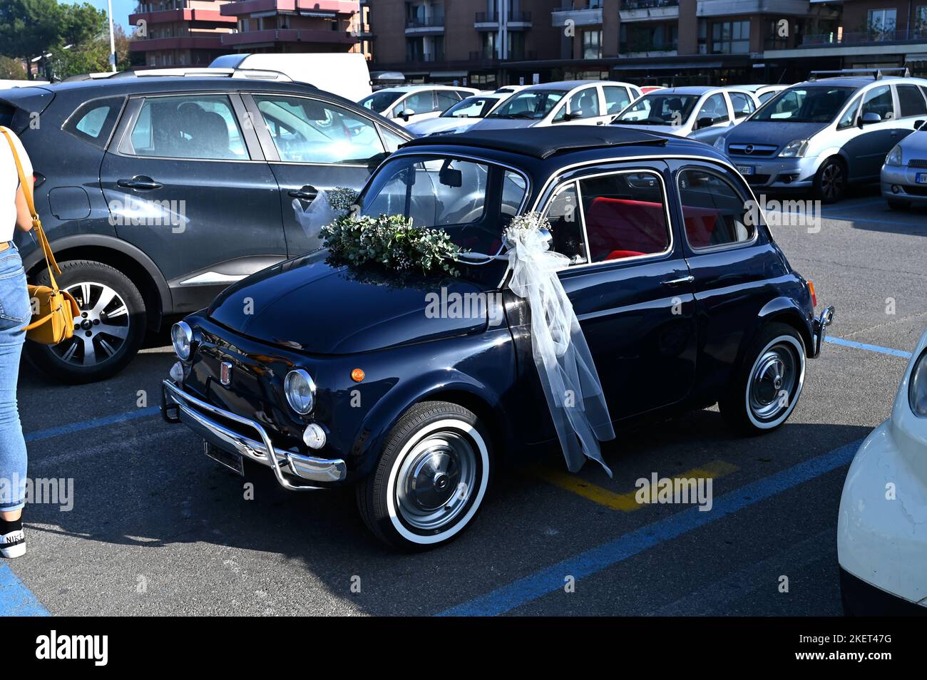 Fiat 500 model. This vintage car about 1970 is still an icon of a piece of Italian automotive history and customs. Used here for a wedding. Stock Photo