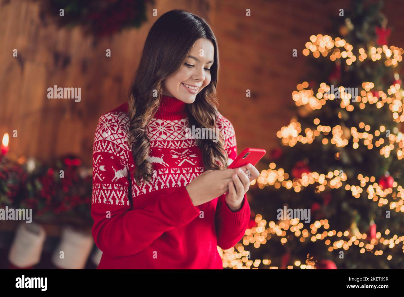 Photo of adorable pretty lady blogger use modern device choose gifts rejoice advent night eve enjoy magic time room house home Stock Photo