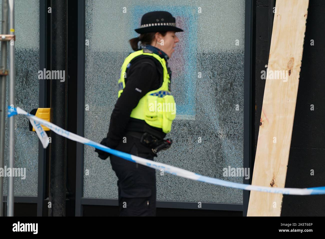 Workmen repairs windows at Barclays Clyde Place Quay branch in Glasgow, after they were broken by members from Extinction Rebellion Scotland as they demand Barclays cut its ties with fossil fuel firms. The protest is part of Extinction Rebellion and Money Rebellion's UK-wide Better without Barclays campaign of disruption. Picture date: Monday November 14, 2022. Stock Photo