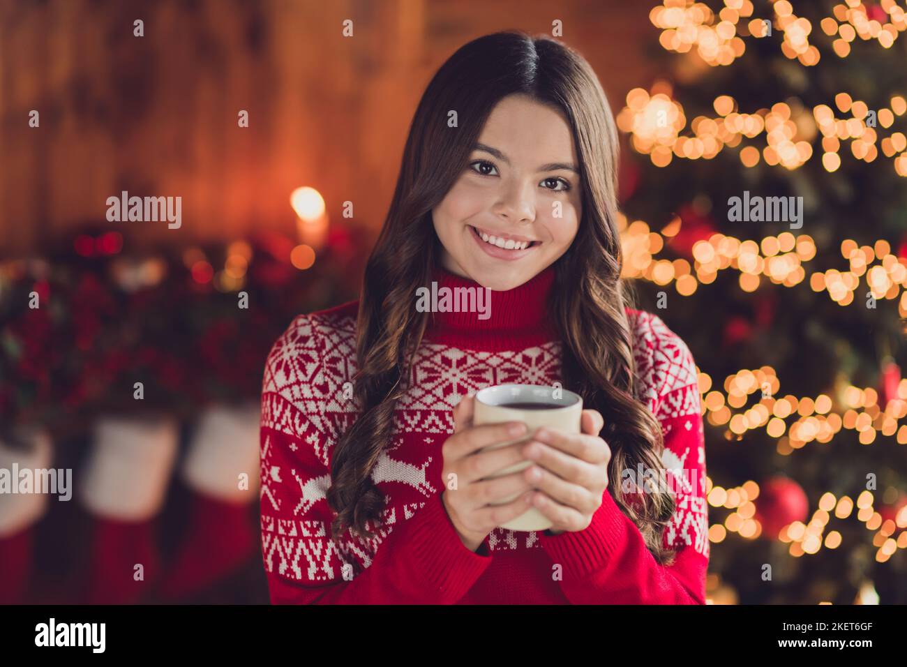 Photo of positive joyful lady wear ugly pullover enjoy cozy evening time hot aroma delicious tasty drink magic time room indoors house Stock Photo