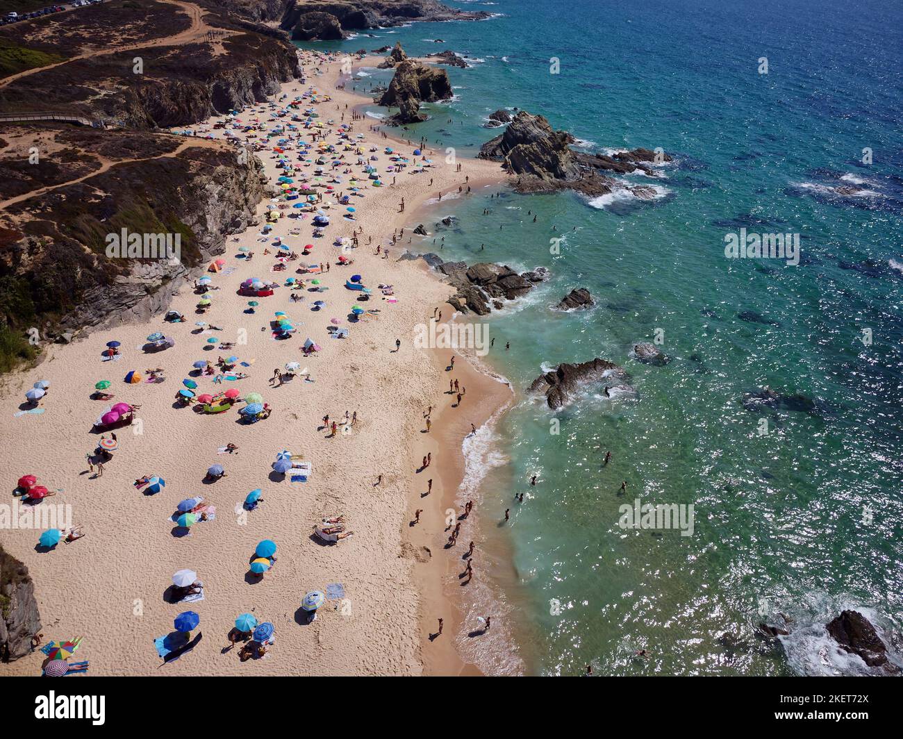 Aerial drone view of busy Beach in Algarve, Portugal during summer holidays. Amazing destinations.  Travel and adventure. Vacations on the seaside. Stock Photo