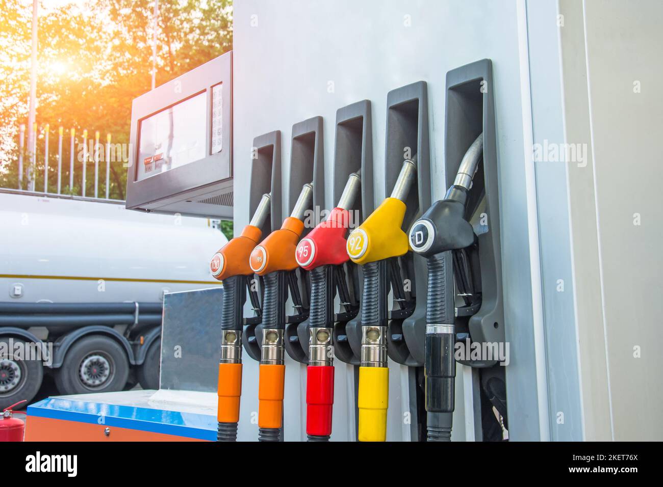 Gas station and filling guns for tank cars with different type of gasoline, rising fuel prices Stock Photo