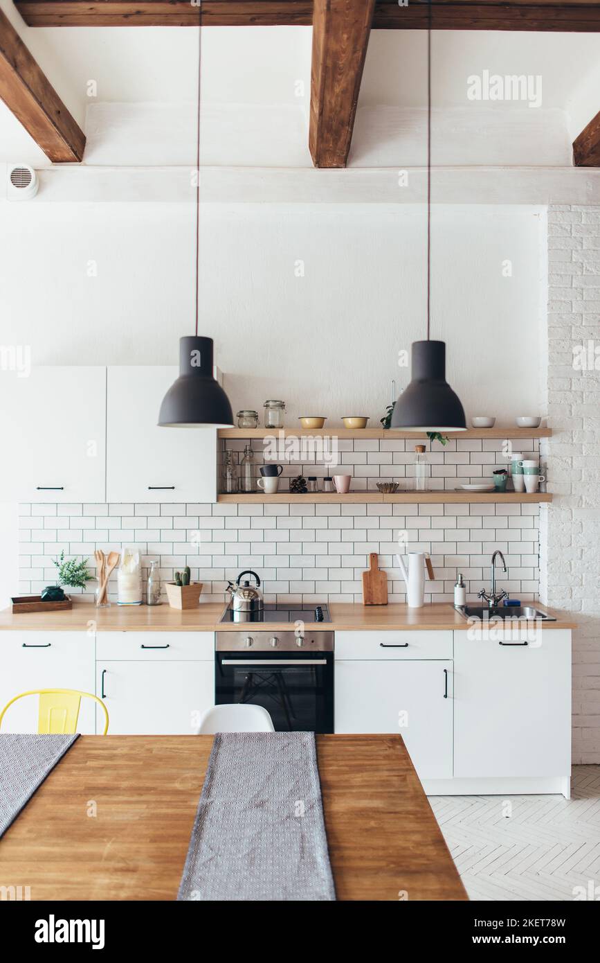 Modern new light interior of kitchen with white furniture and dining ...