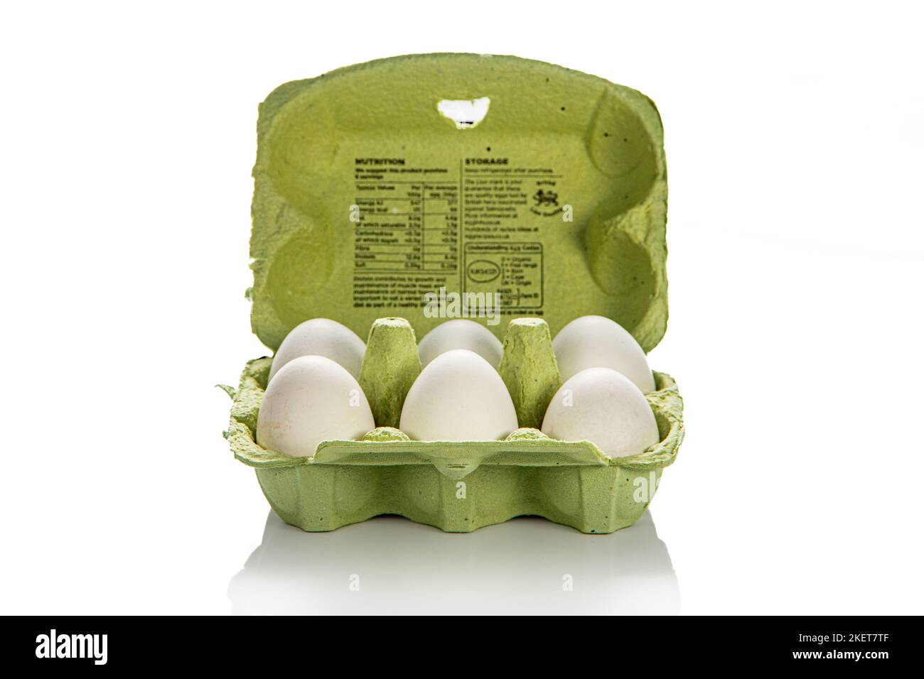 An open carton of 6 white eggs Stock Photo