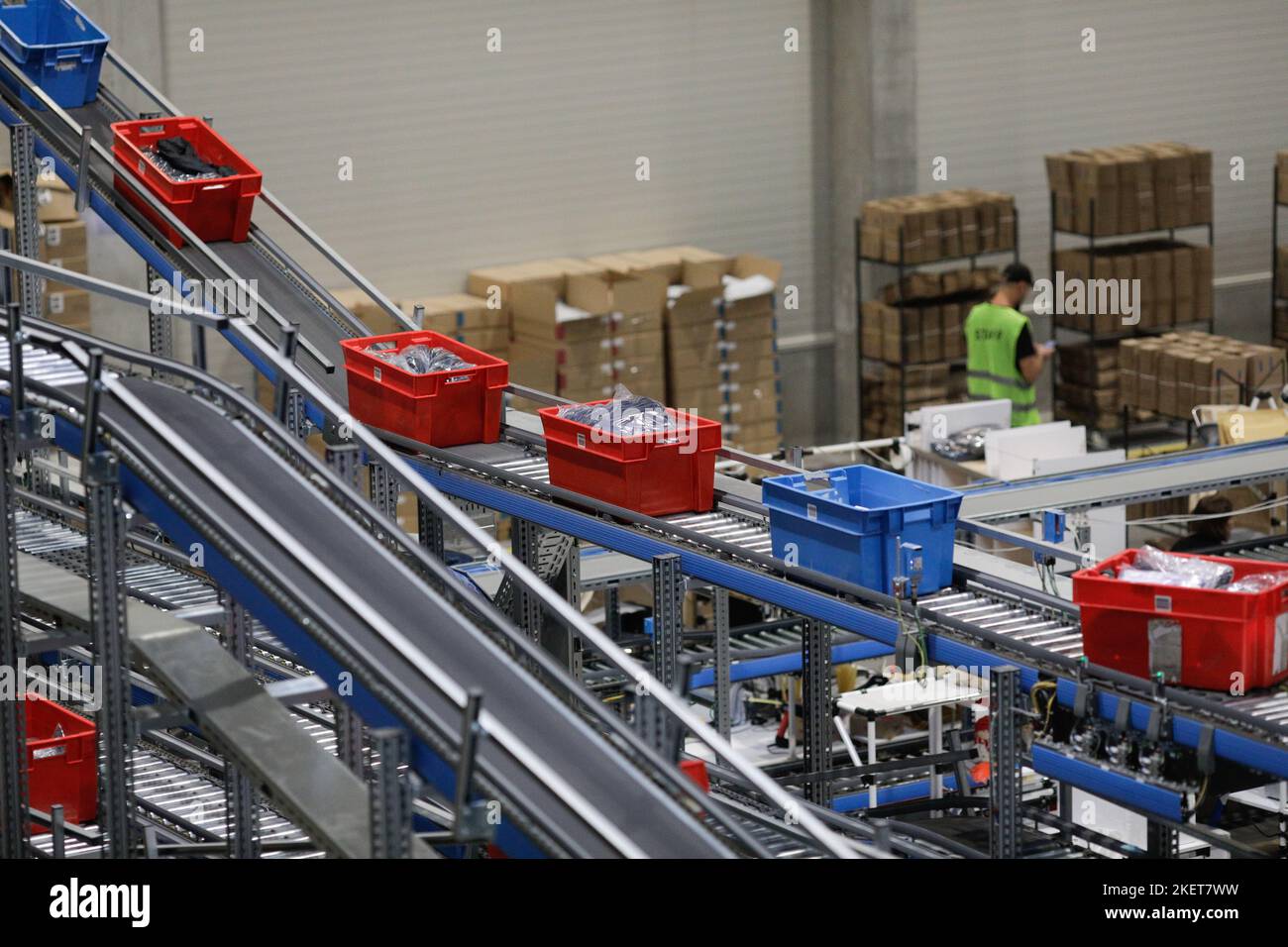 Bucharest, Romania - November 7, 2022: Boxes with products on a conveyor belt in an e-commerce and delivery company. Stock Photo