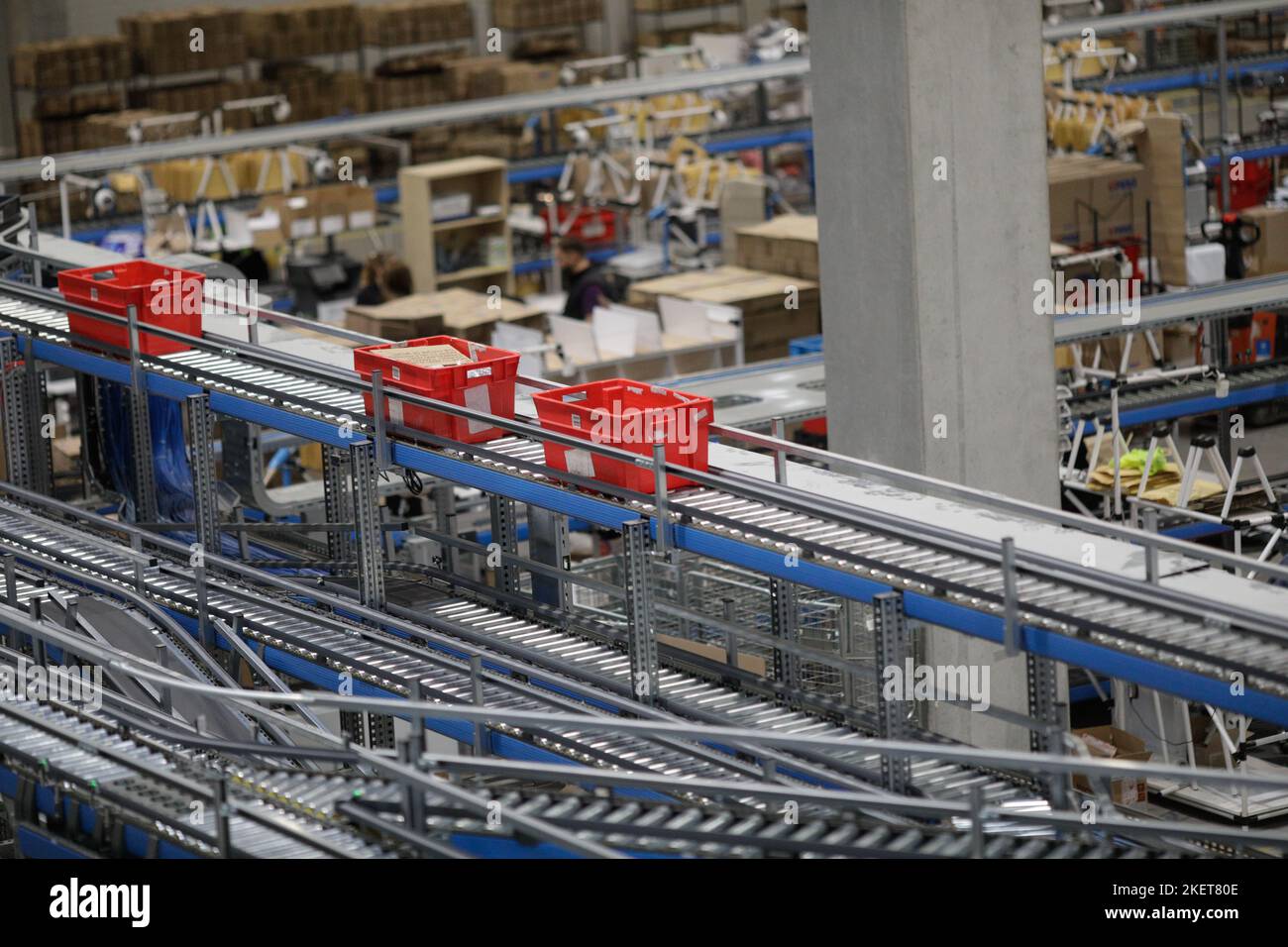 Bucharest, Romania - November 7, 2022: Boxes with products on a conveyor belt in an e-commerce and delivery company. Stock Photo