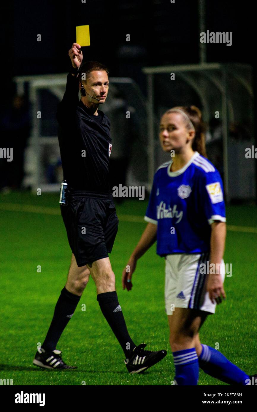 Referee Kim Fisher issues a yellow card to Lisa Owen of Cardiff City Cardiff City v Swansea City in the Orchard Welsh Premier Women's League Cup at Oc Stock Photo