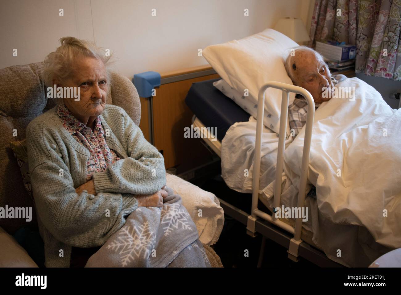 Elderly married couple both in their 80's together in a care home