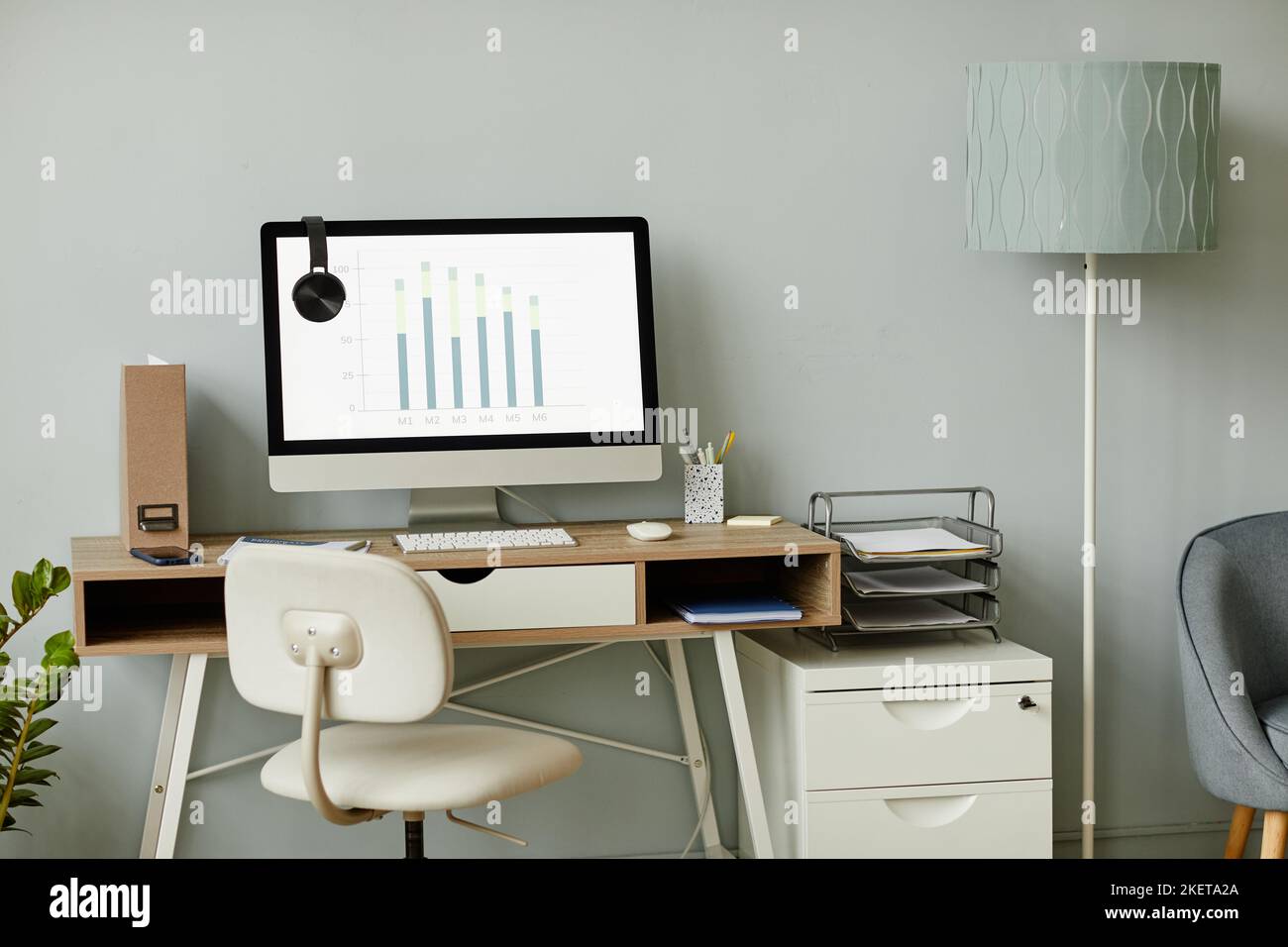 Background image of minimal workplace interior in white tones with PC computer on desk, copy space Stock Photo