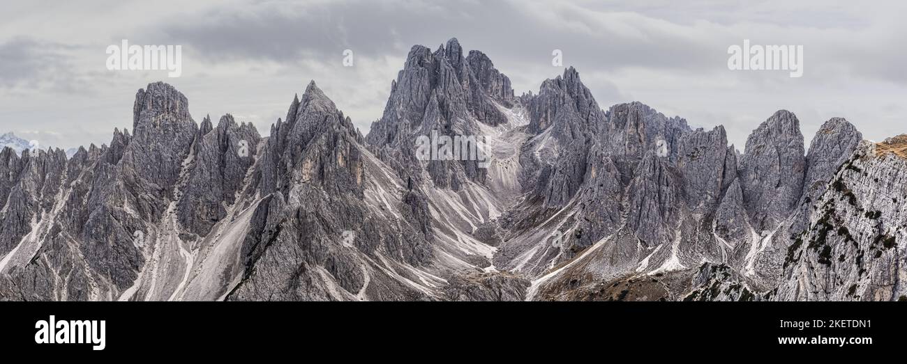 A 3:1 panoramic image from Cadini di Misurina. The peaks of Cadini di Misurina feel like they almost create an amphitheater in this spot in the Tre Ci Stock Photo
